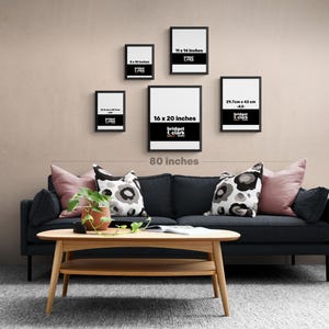 a living room with a black couch and a coffee table