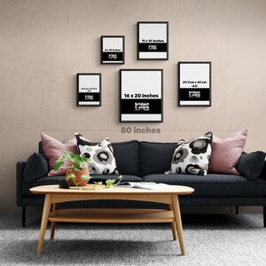 a living room with a black couch and a coffee table