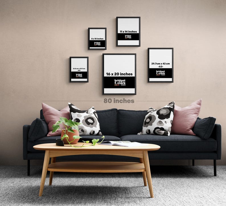 a living room with a black couch and a coffee table