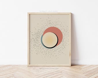 May include: Abstract art print with a beige background, featuring a large circle with a smaller circle inside. The smaller circle is yellow with a black outline, and the larger circle is a combination of red and blue.