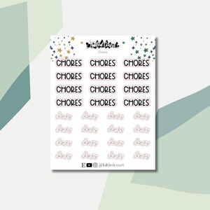 May include: A sheet of planner stickers with the words "CHORES" and "Boty" in black and pink script. The stickers are arranged in rows and columns on a white background. The top of the sheet has star and leaf designs.
