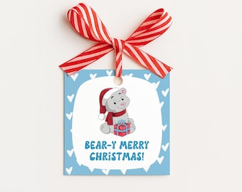May include: A square gift tag with a red and white striped ribbon. The tag has a light blue background with white hearts and a cartoon bear wearing a Santa hat and scarf. The tag reads "BEAR-Y MERRY CHRISTMAS!"