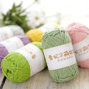 May include: Assortment of yarn balls in various colours, including green, pink, purple, and yellow. The yarn balls have labels with Chinese characters and the text "香妃 采 的 顏色" which translates to "Fragrant Concubine's Colour".