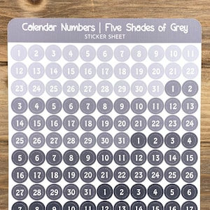 May include: A sticker sheet with calendar numbers 1 through 31 in five shades of gray. The sticker sheet is labeled "Calendar Numbers | Five Shades of Grey" and "Sticker Sheet". The bottom of the sheet says "Purple Pisces Creations" and "purplepiscescreation.etsy.com".