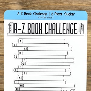 May include: A-Z Book Challenge sticker sheet with a stack of books and a title that reads "A-Z Book Challenge". The sticker sheet is black and white and has a blue border. The sticker sheet is designed to be used for tracking books read.