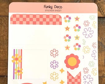 May include: A sticker sheet with a retro theme, featuring the text "GET FUNKY" in colorful bubble letters, a rainbow, flowers, and a smiley face. The sheet also includes checkered patterns and the text "Funky Deco".