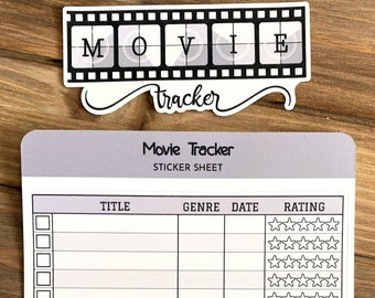 Può includere: Un foglio di adesivi grigio e bianco con il titolo "Movie Tracker" e colonne per titolo, genere, data e valutazione. La colonna di valutazione ha 5 stelle per ogni riga. Il foglio è progettato per tenere traccia dei film visti.