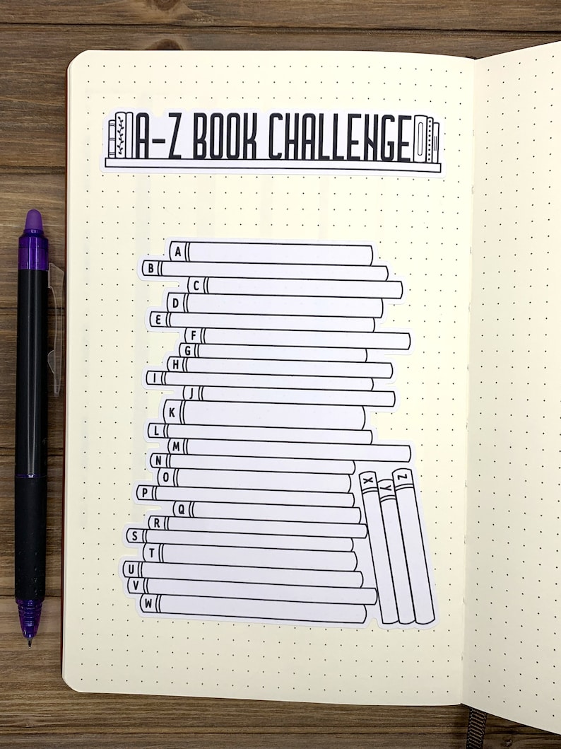 May include: A-Z Book Challenge list with a bookshelf graphic at the top. The list is formatted as a stack of books with each letter of the alphabet labeled on the spine of each book.