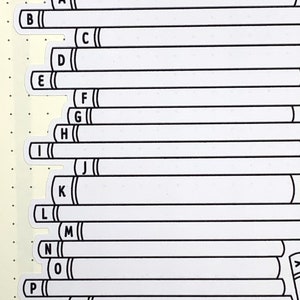 May include: A set of white alphabet letter stickers with black outlines. The letters are arranged vertically in alphabetical order from A to S.