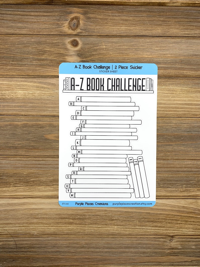 May include: A-Z Book Challenge sticker sheet with a stack of books and a title that reads "A-Z Book Challenge". The sticker sheet is black and white and has a blue border. The sticker sheet is designed to be used for tracking books read.