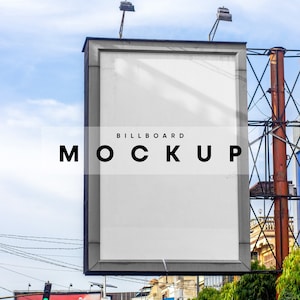 May include: A blank billboard mockup with the text "BILLBOARD MOCKUP" on it. The billboard is mounted on a metal frame and is located in an urban setting.