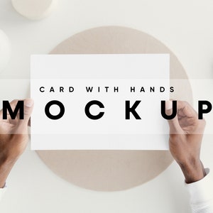 May include: A person's hands holding a blank white card with the text "CARD WITH HANDS MOCKUP" printed on it.