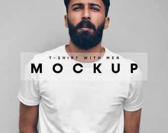 May include: A white t-shirt mockup with the text "T-SHIRT WITH MEN MOCKUP" in black. The t-shirt is being worn by a person with a dark beard and hair. The background is a solid gray color.