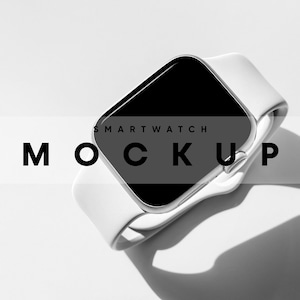 May include: White smartwatch with a black screen and a white strap. The watch is on a white surface and the text "SMARTWATCH MOCKUP" is visible.