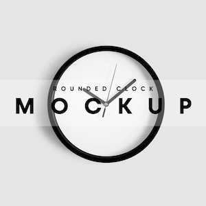 May include: A black rounded clock with black hands on a white background. The clock is on a white wall. The text "ROUNDED CLOCK MOCKUP" is visible in the image.