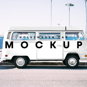 May include: A white Volkswagen van with the text "VOLKSWAGEN CAR MOCKUP" on the side. The van is parked on a street with a blue fence in the background.