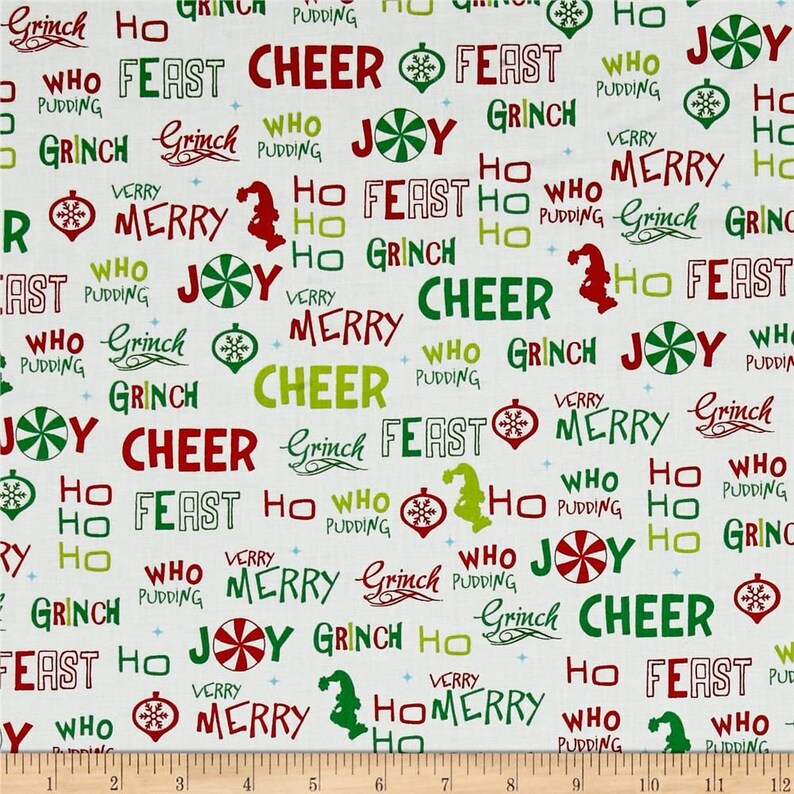 May include: White fabric with a repeating pattern of green, red, and yellow text. The text includes the words "Grinch", "Who", "Feast", "Cheer", "Joy", "Merry", "Ho", and "Pudding".