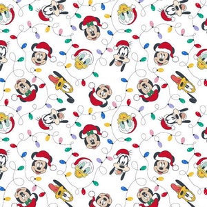 May include: White fabric with a repeating pattern of various Disney characters, including Mickey Mouse, Minnie Mouse, Donald Duck, Goofy, and Pluto. The characters are wearing Christmas hats and are surrounded by strings of Christmas lights.