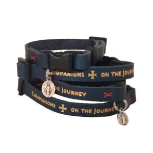 Navy blue leather cat collar. adjustable. Gold foil leather stamp lettering. Companions on the journey. Holy medals options: miraculous medal or St Benedict medal.