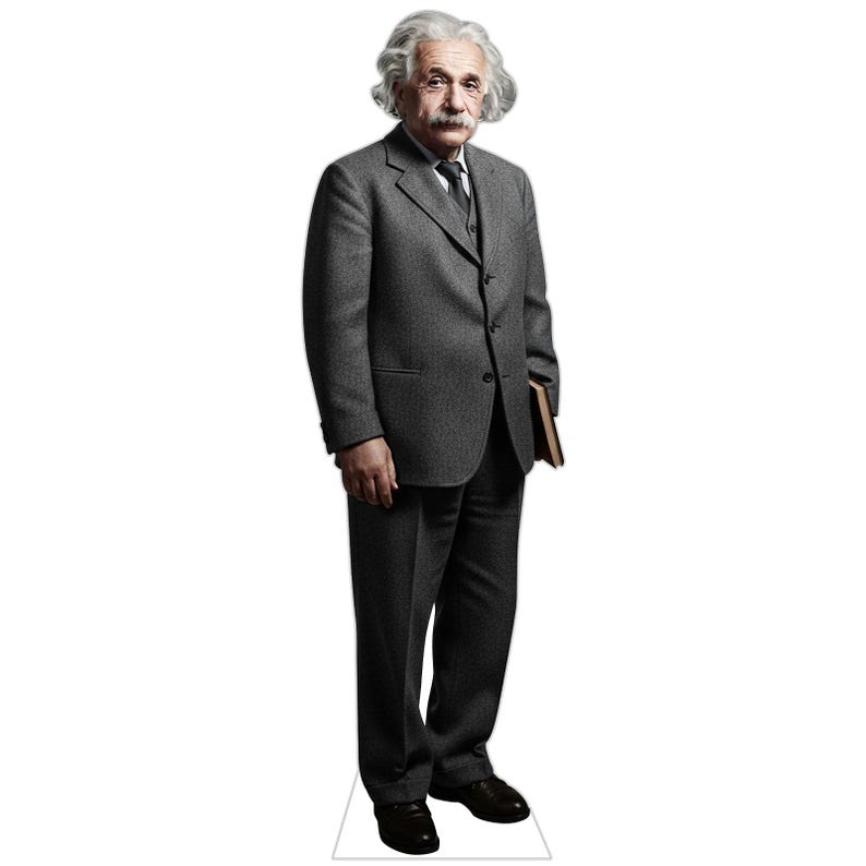 May include: A life-sized cardboard cutout of Albert Einstein standing in a grey suit, white shirt, and dark tie. The figure has white hair, a mustache, and holds a brown book under one arm. The cutout is mounted on a white base for stability.