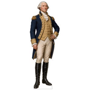 May include: A life-sized cardboard cutout of George Washington wearing a dark blue military coat with gold buttons and epaulets, a tan vest, white breeches, a ruffled cravat, and tall black leather boots, standing in a formal military pose.