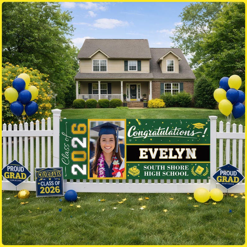 May include: A graduation banner with a photo of a graduate, the text "Congratulations! EVELYN SOUTH SHORE HIGH SCHOOL Class of 2026", and two signs that say "Proud Grad" and "Congrats Class of 2026". The banner is green and gold.