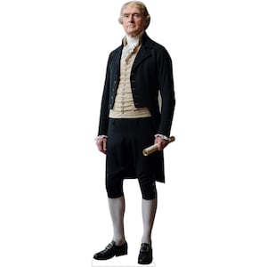 May include: A life-sized cardboard cutout of Thomas Jefferson wearing an 18th-century black tailcoat, a beige waistcoat with silver buttons, a white ruffled cravat, knee-length black breeches, white stockings, and black buckled shoes, holding a scroll.