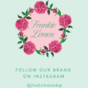 May include: A pink and green floral wreath with the text "Frankie Lemon" in the center. The text below the wreath says "Follow our brand on Instagram @frankielemonshop".