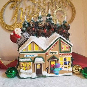 Santa & reindeer flying over village, Ceramic Christmas Village