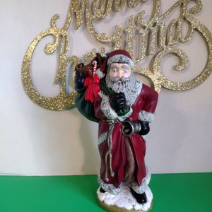 Bell Ringing Santa Claus Delivering Toys, hand painted ceramic Christmas decor