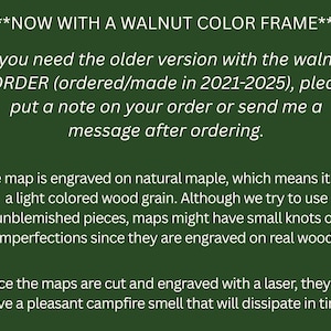 May include: Text on a green background. The text states the product is now with a walnut color frame. It also mentions the map is engraved on natural maple with a light wood grain and may have imperfections.