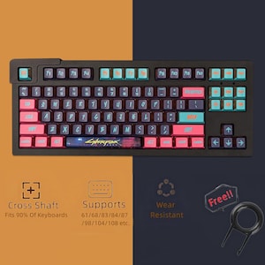 May include: Black mechanical keyboard with teal, pink, and orange keycaps. The keyboard has the text "Cyberpunk 2077" on the spacebar. Includes a keycap puller. Supports 90% of keyboards and is wear-resistant.