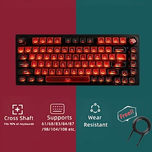 Puede incluir: Teclado mecánico negro con teclas retroiluminadas en rojo. El teclado presenta una distribución QWERTY estándar con teclas de función y una barra de acento roja. El texto incluye "Cross Shaft", "Supports" y "Wear Resistant". Se incluye un extractor de teclas.