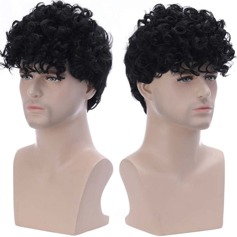 May include: A black curly wig on a mannequin head. The wig is styled in a short, textured, and voluminous look.