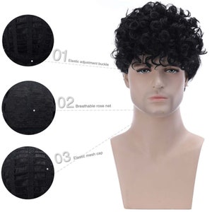 May include: A black curly wig with a breathable rose net cap and an elastic adjustment buckle. The wig is on a mannequin head.