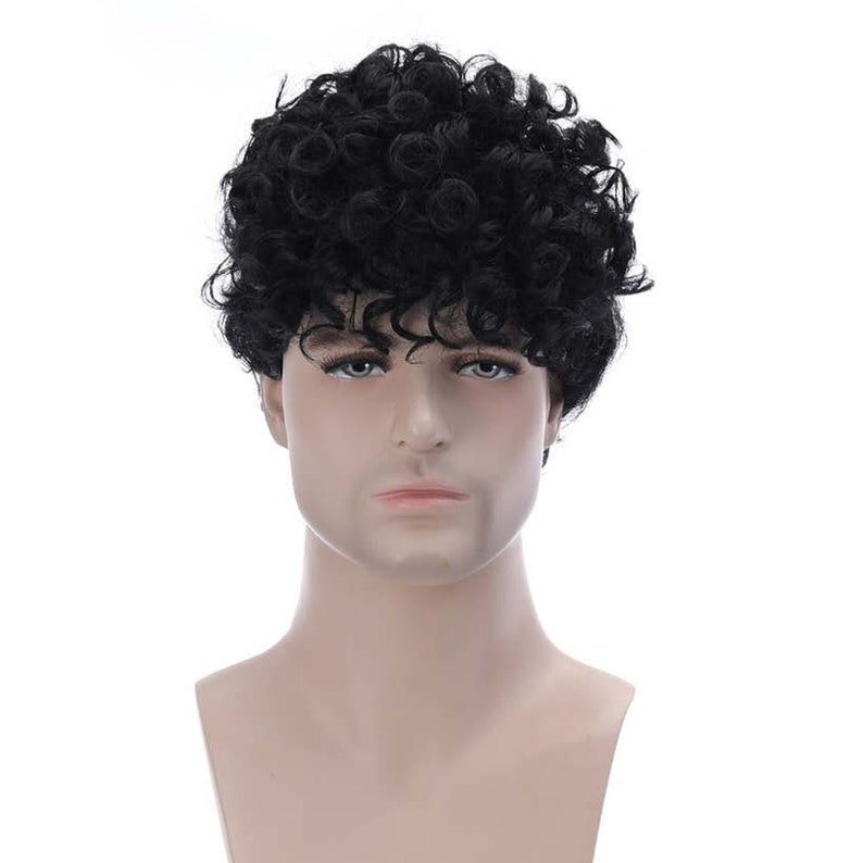 May include: A black curly wig on a mannequin head. The wig is short and has a natural looking texture.