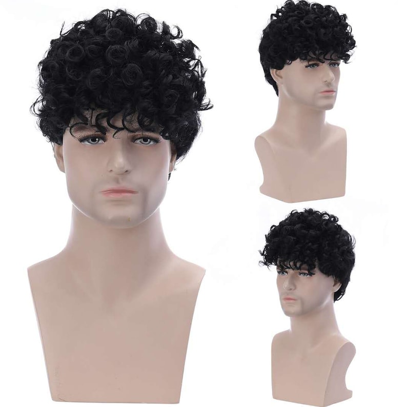 May include: A black curly wig on a mannequin head. The wig is short and has a natural looking texture.