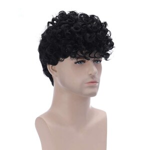 May include: A black curly wig on a mannequin head. The wig is short and has a side part.