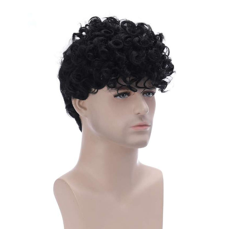 May include: A black curly wig on a mannequin head. The wig is short and has a side part.