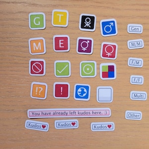 May include: A set of colourful square stickers with various symbols and letters. The stickers include letters G, T, M, E, symbols for male, female, and gender neutral, and other symbols. The text "You have already left kudos here. :)" is also included. The stickers are on a wooden surface.