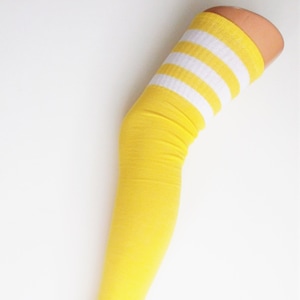 May include: Yellow thigh-high socks with white stripes.