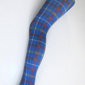 May include: Blue tartan tights with a traditional design. The tights display a repeating pattern of red, yellow, and white lines on a blue base. The tights are made of a soft, stretchy fabric.