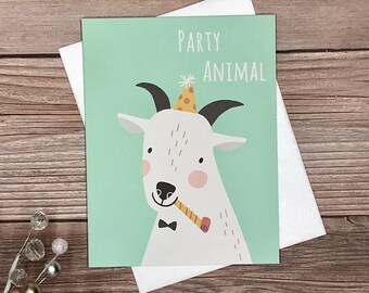 May include: A green card with a white goat wearing a party hat and holding a party favor. The text "PARTY ANIMAL" is printed on the card.