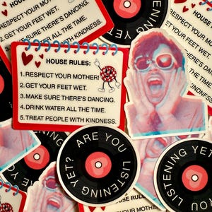 May include: A collection of stickers with various designs. Some stickers feature a vinyl record design with the text "Are you listening yet?" and "Listening yet?". Other stickers have the text "House Rules" with a list of rules and a dancing disco ball.