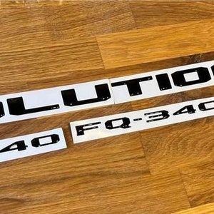 May include: White stickers with black text reading "EVOLUTION VIII MR", "FQ-340", and "FQ-340".