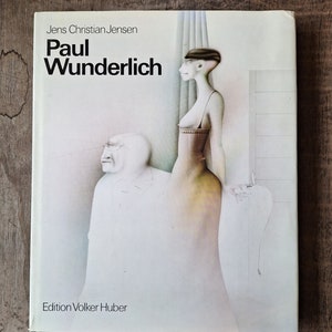 May include: A white book cover with the title "Paul Wunderlich" in black text. The author's name, "Jens Christian Jensen", is printed above the title. The cover features a painting of a woman in a long, flowing dress and a man in a suit. The text "Edition Volker Huber" is printed at the bottom of the cover.
