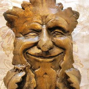 Concrete Winking Odin Tree Face