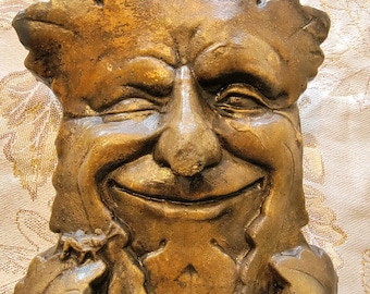 Concrete Winking Odin Tree Face