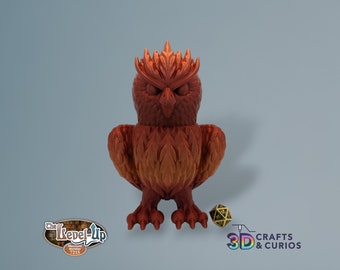 May include: A 3D printed, orange-brown owl figurine with a spiky crest and detailed feathers. The owl is standing on a light blue surface with a black and gold dice in the foreground.