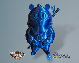 May include: A blue 3D printed panda figurine wearing a belt with a circular design and holding a bamboo stick with leaves. The panda is standing on a white surface. The text "3D CRAFTS & CURIOS" is visible in the lower right corner of the image.